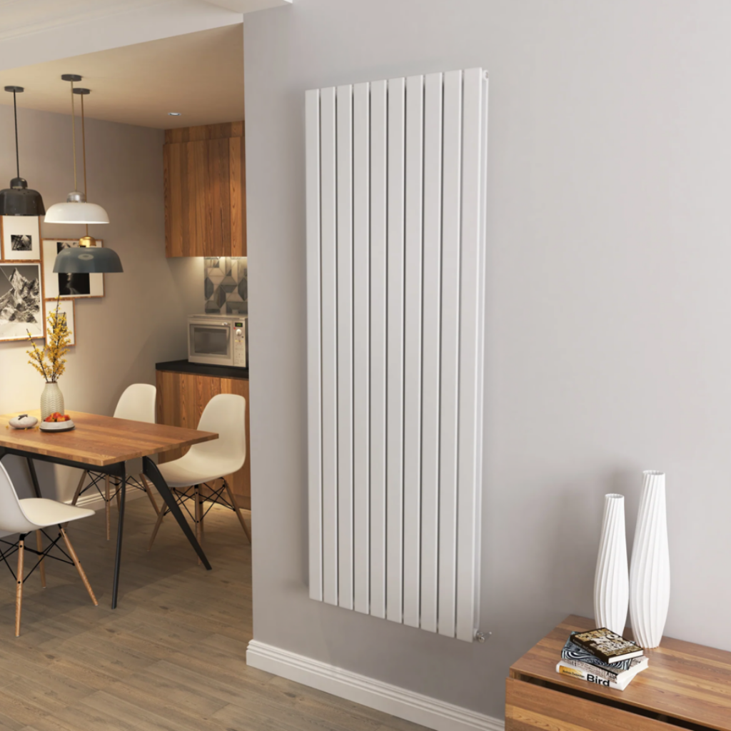 A modern white radiator in a well-lit room, blending seamlessly with the minimalist interior design.