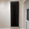 Black designer vertical oval radiator single panel