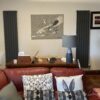 Two anthracite vertical radiators installed in a living room
